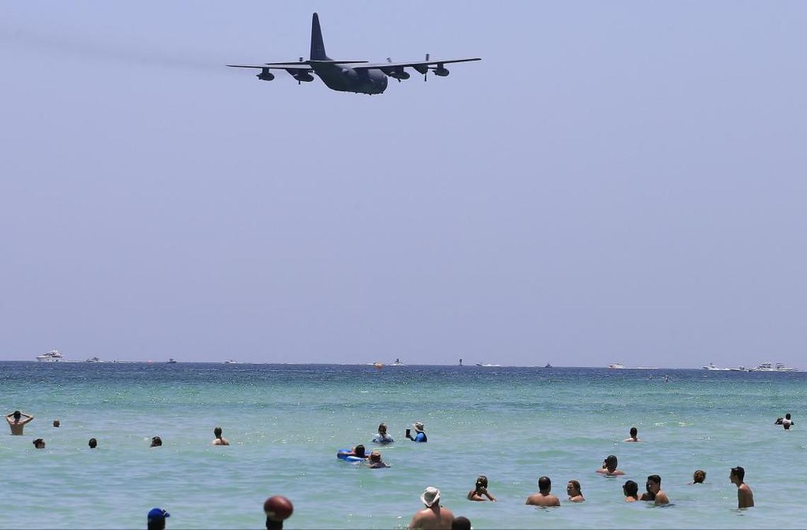 The U.S. Air Force C-130 Hercules flies over beachgoers in Miami Beach during the air and sea show on Sunday.
