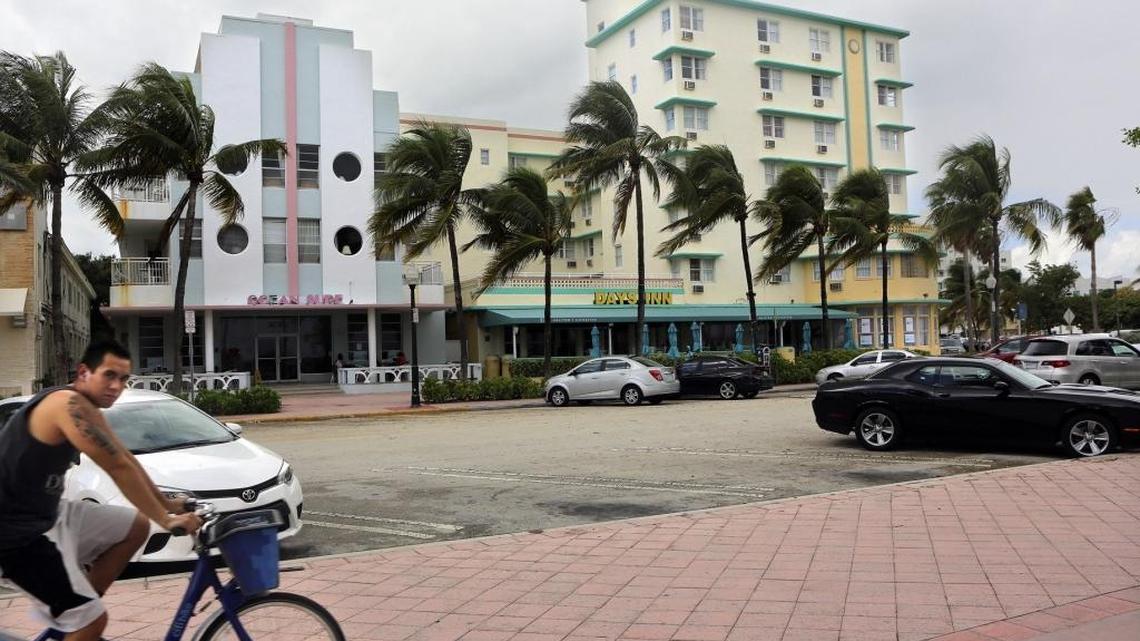 A man bikes toward the Ocean Surf and Days Inn at Miami Beach's Ocean Terrace on Friday, Oct. 23, 2015. Miami Beach voters will consider a controversial proposed upzoning of this small historic district in North Beach. The district is two blocks long -- a miniature Ocean Drive with a collection of Deco and MiMo motels, some that are run down or shuttered. The little beachfront street runs parallel to Collins, between 73rd and 75th streets. A developer wants to build high-rise towers, which would require demolition of some existing buildings. Proponents, including a group called For a Better North Beach, claim the area's blighted, despite it being home to a thriving immigrant community. Opponents fear it's the start of the gentrification of North Beach, pushing out lower-income people for luxury condo owners.