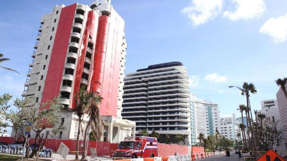 A Miami Beach Fire Rescue truck sits parked outside a building on Collins Avenue and 35th Street where a man died after falling from the 10th floor of the building on Friday, Oct. 20, 2017.