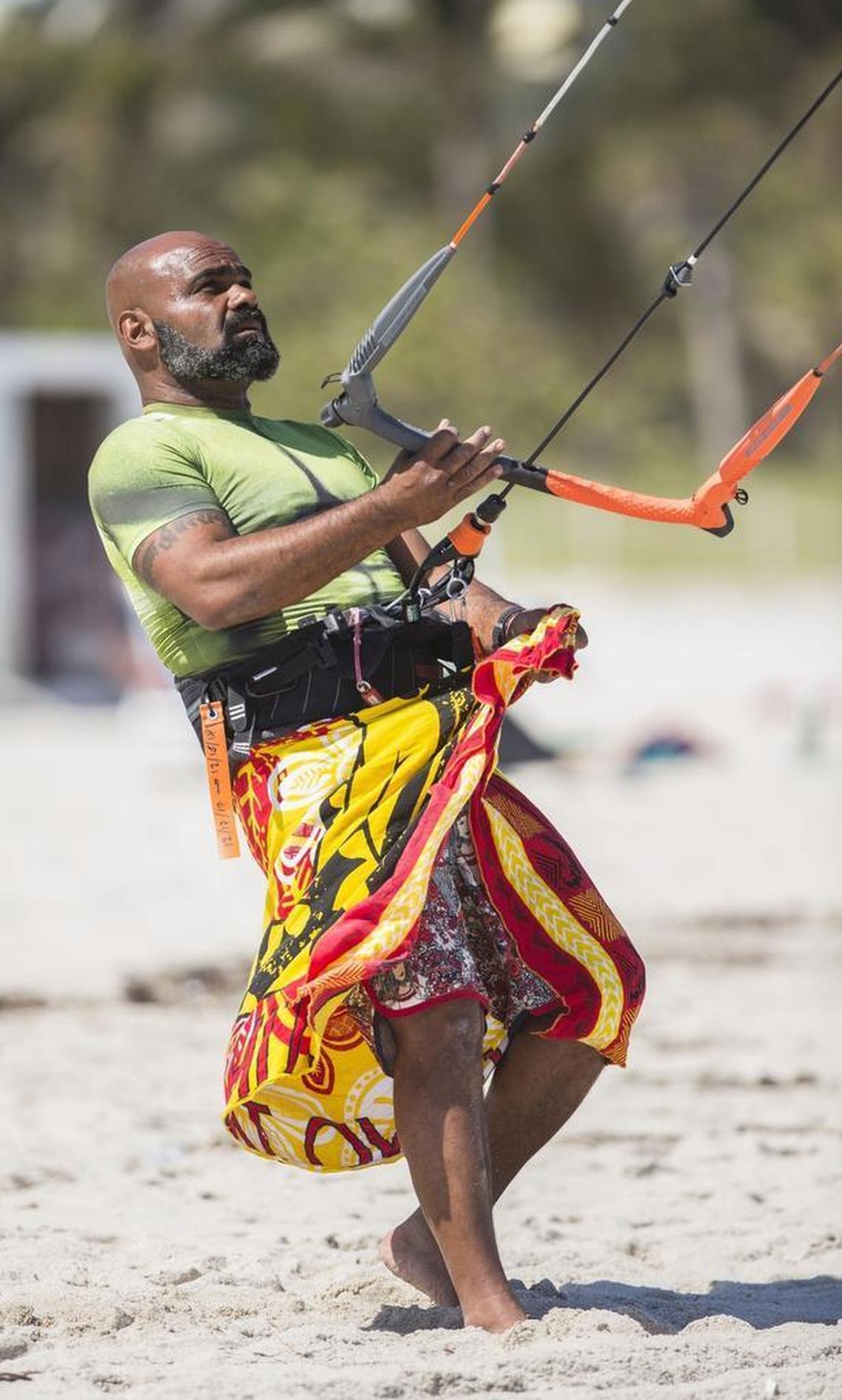 Luco Romero prepares to launch off the beach and help raise awareness about safe kiteboarding procedures to dissuade city officials from restricting when and where they can launch.