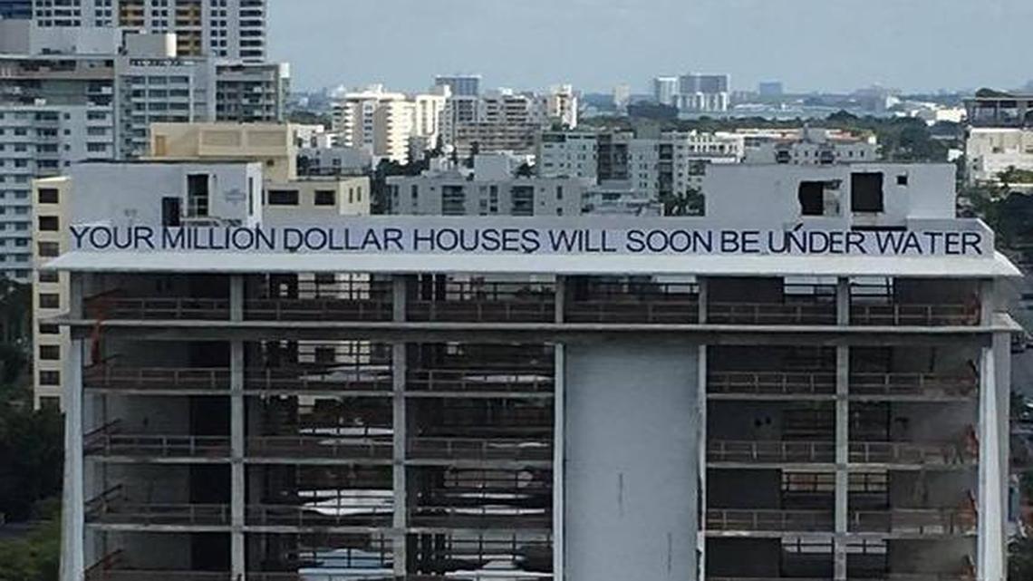 Late Monday night, someone painted this message across the top of the old South Shore Hospital building in South Beach.