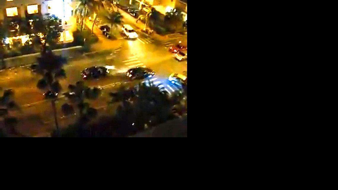 
In this screengrab taken from a YouTube video, Herisse’s car is shown speeding down a Miami Beach street Memorial Day weekend as officers surround it with guns drawn and fire.
