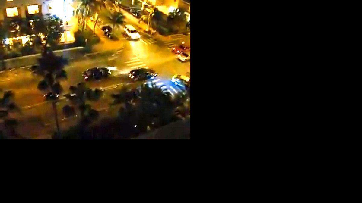 
In this screengrab taken from a YouTube video, Herisse’s car is shown speeding down a Miami Beach street Memorial Day weekend as officers surround it with guns drawn and fire.
