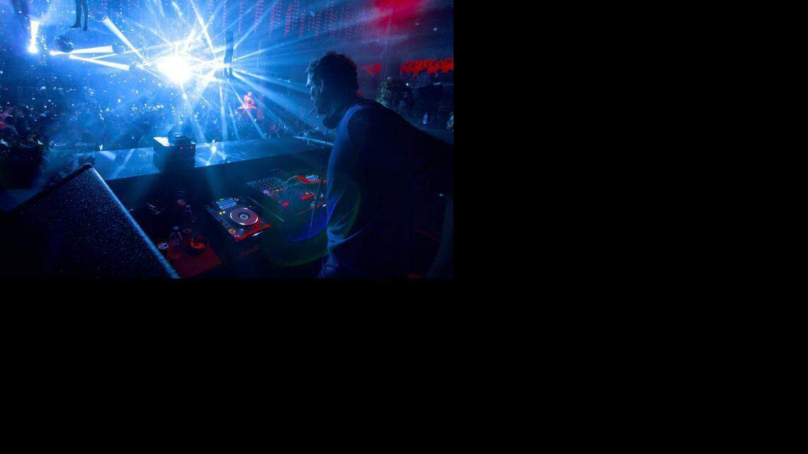 
Former Miami Heat center Rony Seikaly spins discs during his DJ set at STORY in Miami Beach during the early hours of Sunday, March 22.
