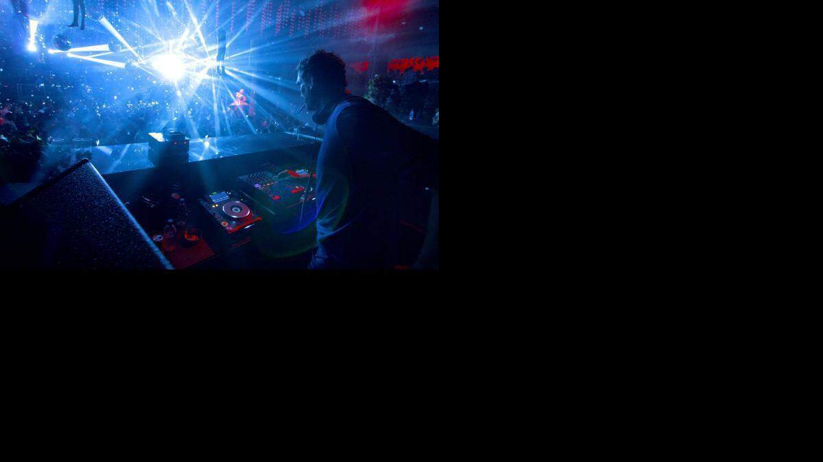 
Former Miami Heat center Rony Seikaly spins discs during his DJ set at STORY in Miami Beach during the early hours of Sunday, March 22.

