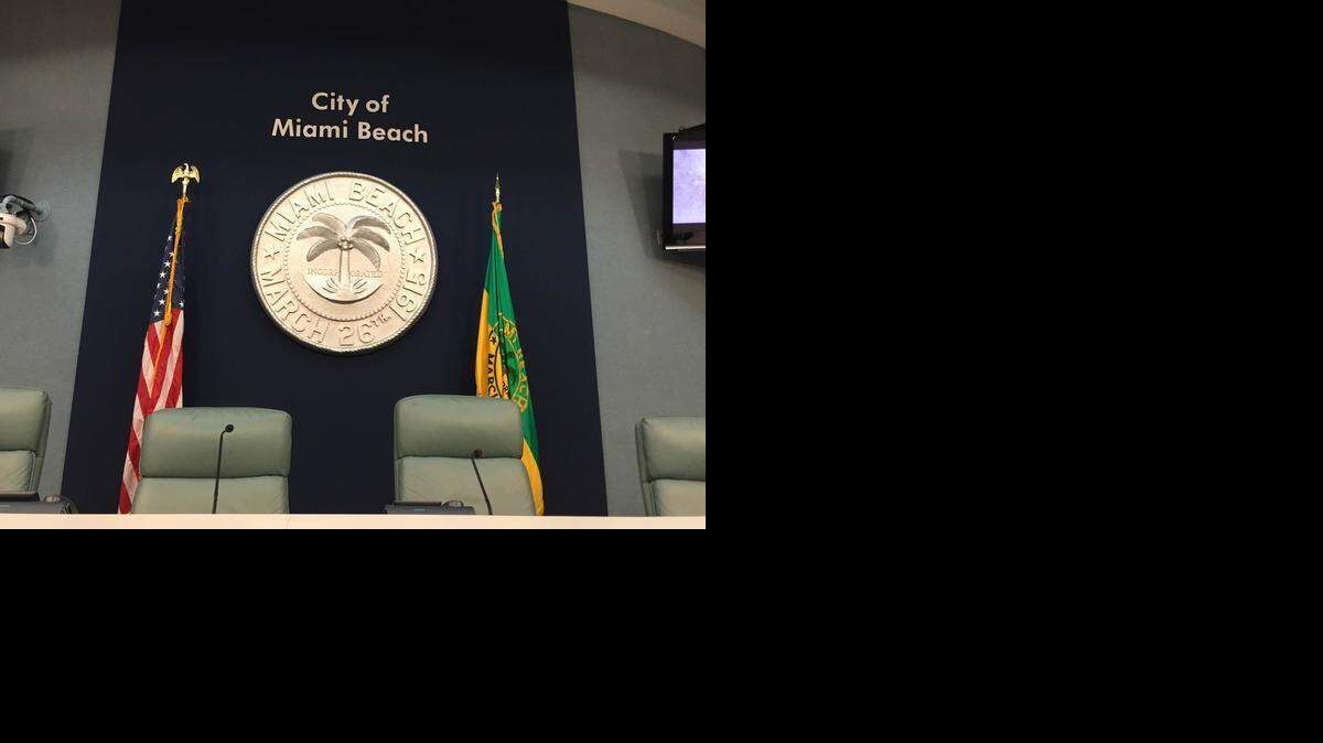 
Miami Beach’s seal hangs over the dais at City Hall.
