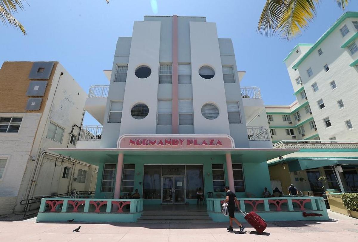 A new sign graces an old hotel for the shooting of the upcoming season of the FX series "American Crime Story," which will be about the murder of Gianni Versace.