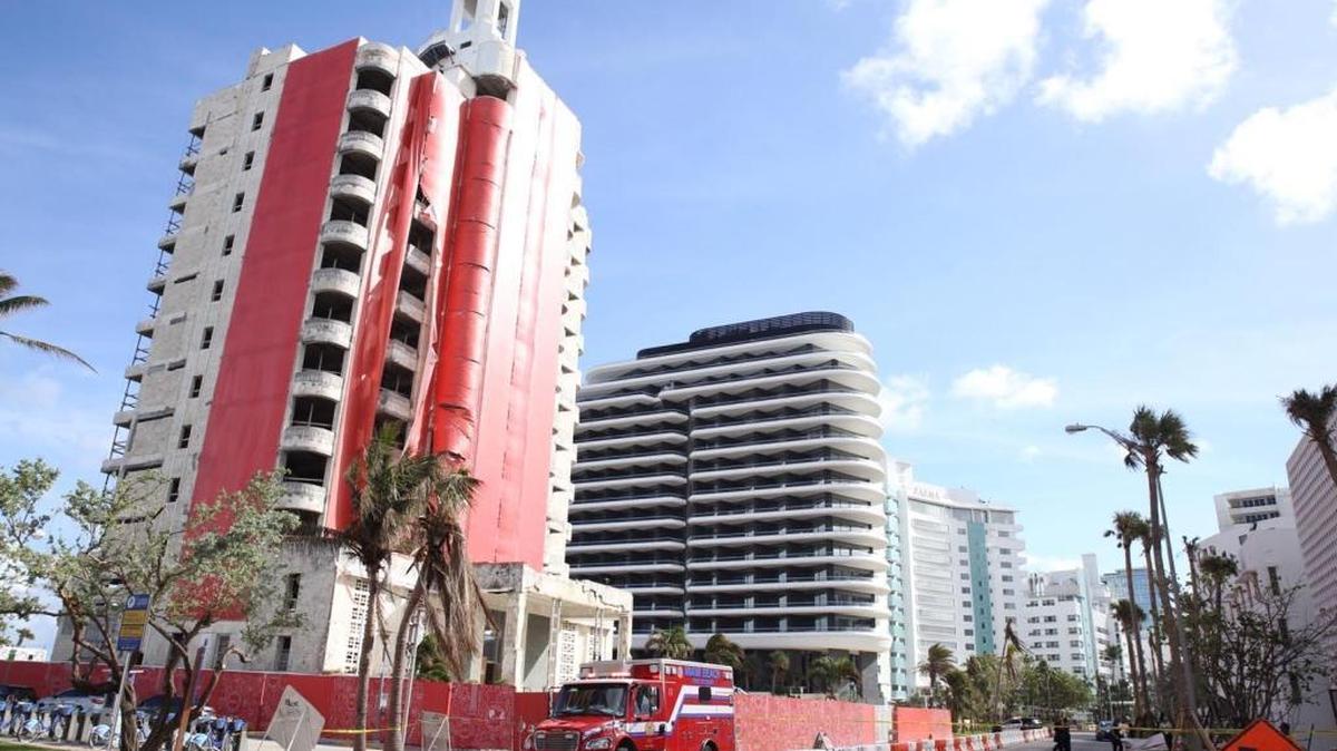 A Miami Beach Fire Rescue truck sits outside the former Versailles Hotel at 3425 Collins Ave. in Miami Beach after a construction worker fell from the 10th floor Friday, Oct. 20, 2017. The man died. The building was unoccupied and under construction.