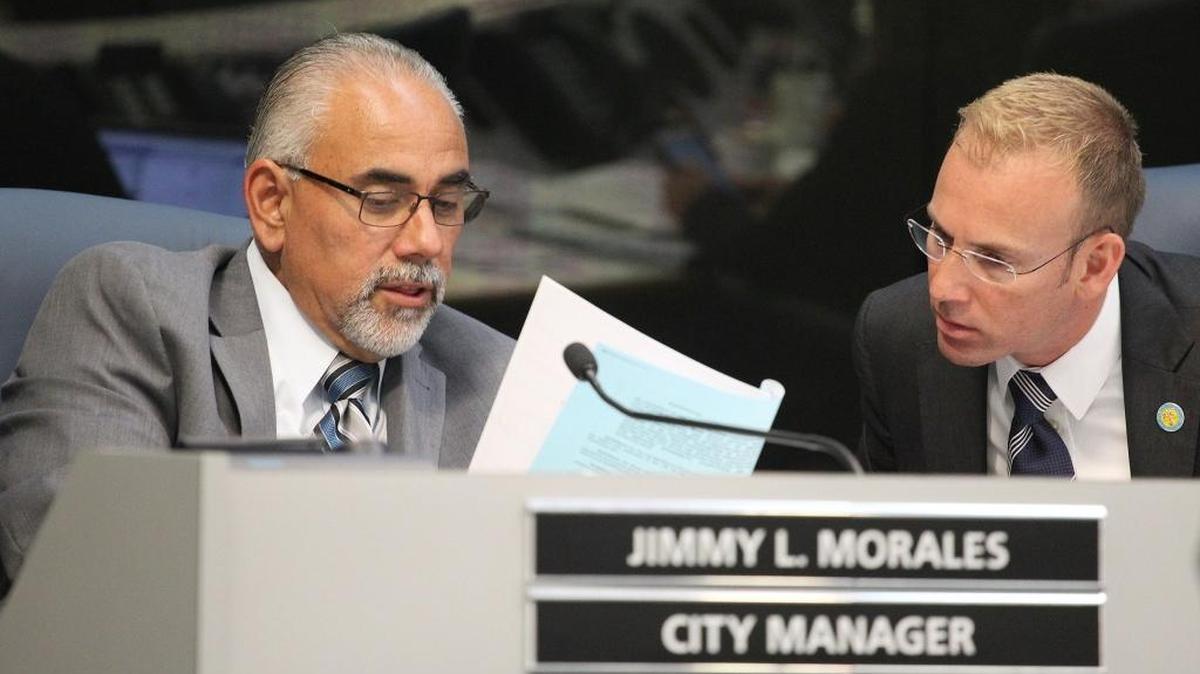 Miami Beach City Manager Jimmy Morales, left, and Miami Beach Commissioner Michael Grieco, right, at the city commission meeting on Wednesday, Jan. 11, 2017.