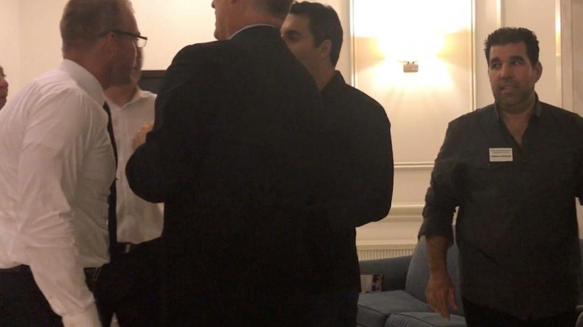 Commissioner and candidate Michael Grieco, left, yells at former political opponent Dave Crystal, standing in rear middle, during a confrontation after a public forum Thursday.