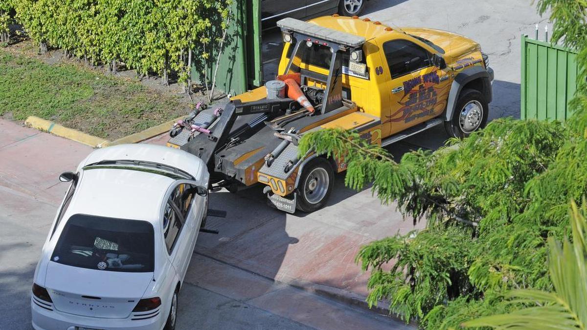 A wrecker tows into Tremont Towing company 1916 Bay Road, Miami Beach, in 2011.