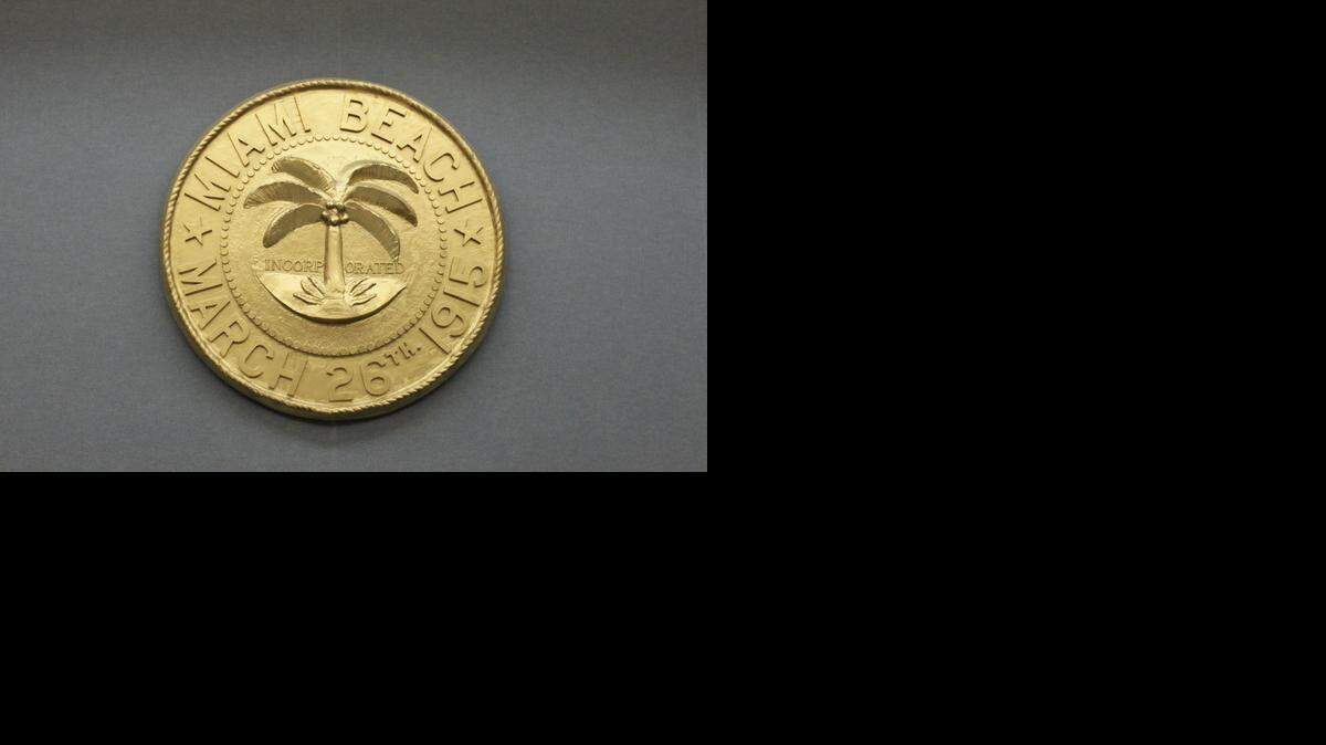 
The city of Miami Beach’s seal overlooks the dais where city commissioners approved the city’s property tax rate and budget for the new fiscal year.
