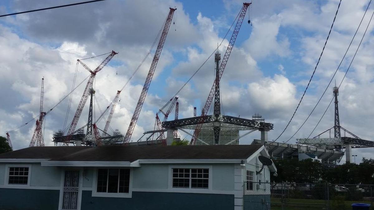 The view of Dolphins stadium from a Miami Gardens neighborhood to the north. The venue has loomed large over the city for decades and with another Super Bowl coming in 2020 the city hopes it will benefit.