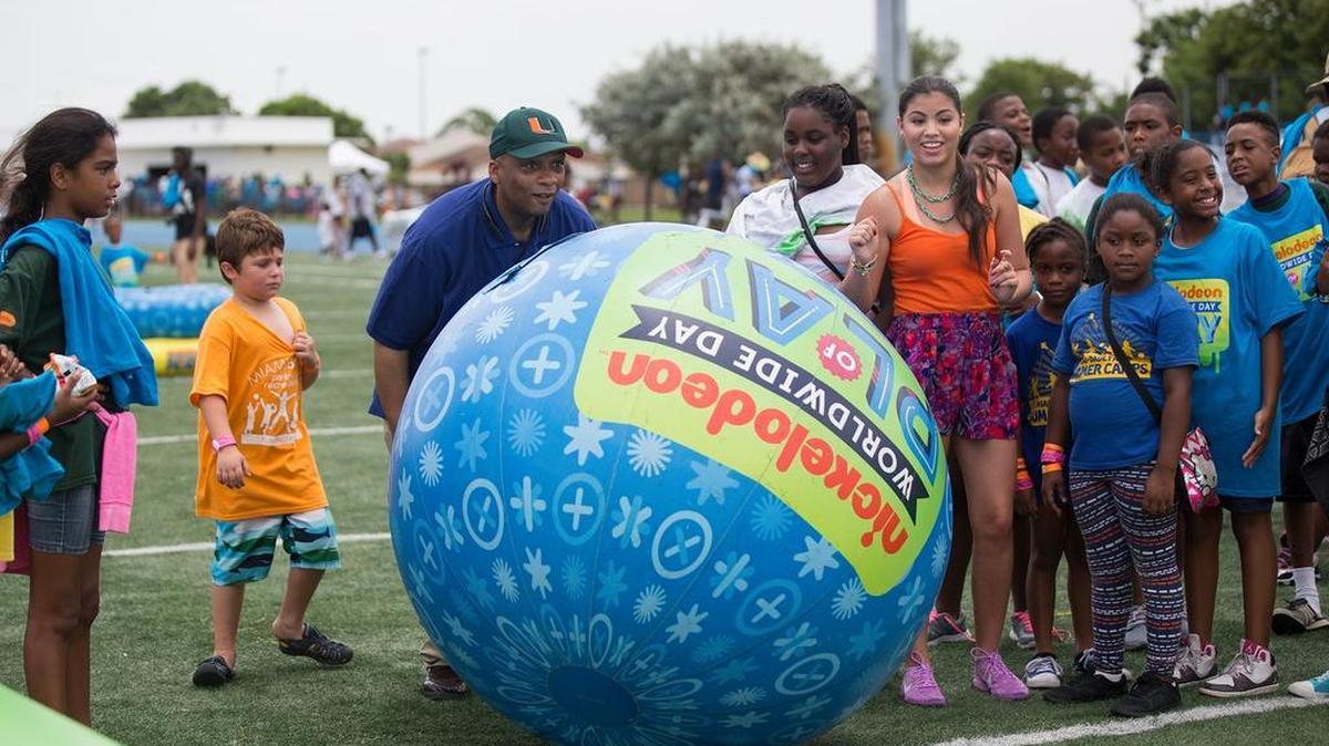 Miami Gardens Mayor Oliver Gilbert and Paola Andino, star of Nickelodeonâs âEvery Witch Way,â play a giant game of bowling with kids at the Intercity Summer Games held at Betty T. Ferguson Center in Miami Gardens on Thursday, July 30, 2015.