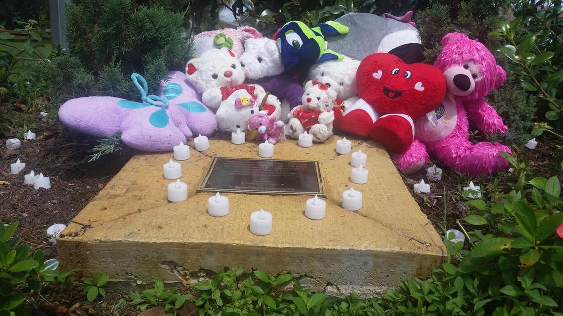 
Teddy bears and stuffed animals adorn a plaque beneath a tree planted in Tequila Forshee’s memory at Lester Brown Park in Miami Gardens.
