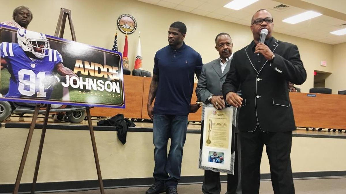 NFL wide receiver Andre Johnson, left, along with childhood former coach Ed Brown and Commissioner Terence Pinder, shares some words Wednesday about the upbringing of the seven-time Pro Bowl player. Johnson was released by the Indianapolis Colts the day before.