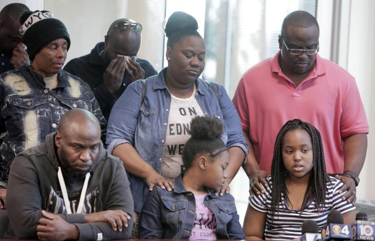 Hailey Grant, 11, sitting on the right, asks for the person who killed her mother, Alicia Roundtree, to turn themselves in as the rest of the family listens. Seated from left, Alicia’s brother Greg Roundtree and niece Zaniya Woods, 13. Alicia Roundtree was killed Saturday as she drove home from Publix on Northwest 183rd Street. The press conference was called to help police find the shooter.