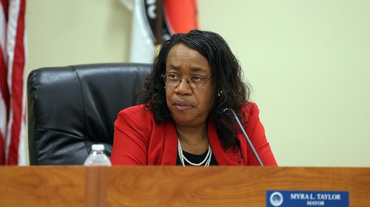 Opa-locka mayor Myra Taylor sits on the dais at a commision meeting on Wednesday, May 11, 2016, where the future of the embattled city was discussed, as well as the city manager, who was facing corruption allegations and has since been criminally charged.