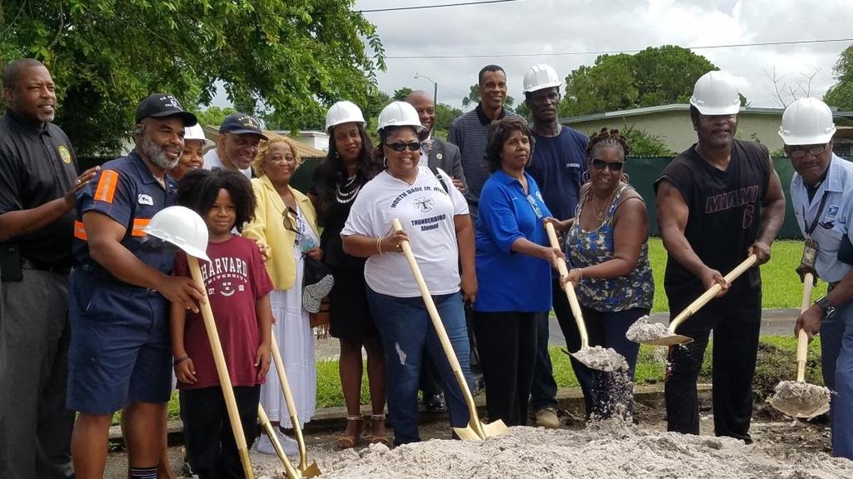 Miami Gardens city officials pose with residents at the Bunche Park Pool groundbreaking ceremony last August.