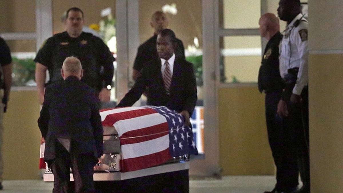 The casket of Sgt. La David T. Johnson, of Miami Gardens, is carried out of the Christ The Rock Church Friday, Oct. 20, 2017, after a viewing in Cooper City. Funeral services will take place Saturday.