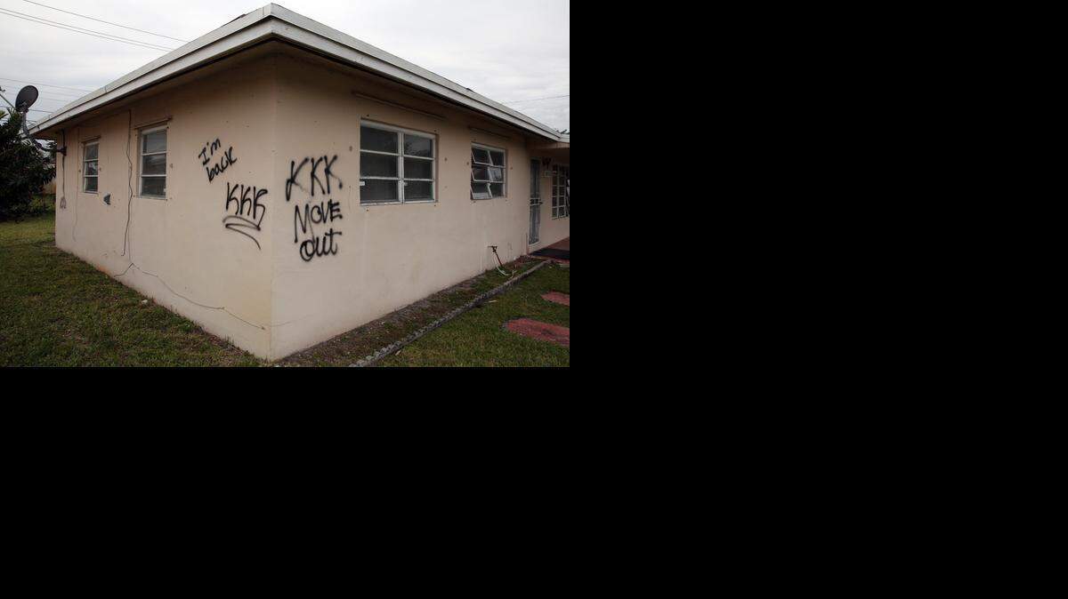 
A Miami Gardens home at 18010 NW 43rd Court was vandalized with hateful messages on Wednesday, Feb. 18, 2015. 
