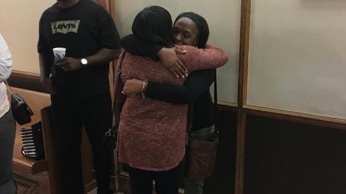 Allreatha Clay, the mother of murder victim Roger Glen, embraces the mother of his killer, Maurice Talley. Talley was sentenced this week to life in prison for the killing over a $10 debt.