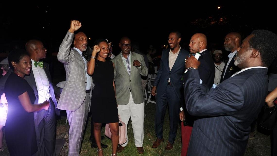 Opa-locka officials, residents and artist Hank Willis Thomas on Oct. 17, 2017, celebrate dedication of his new artwork at Town Center Apartments.