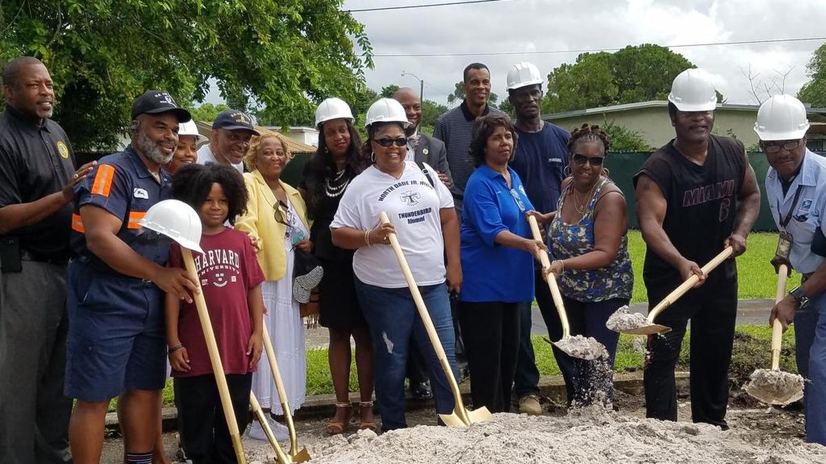 Miami Gardens city officials pose with residents at the Bunche Park Pool groundbreaking ceremony