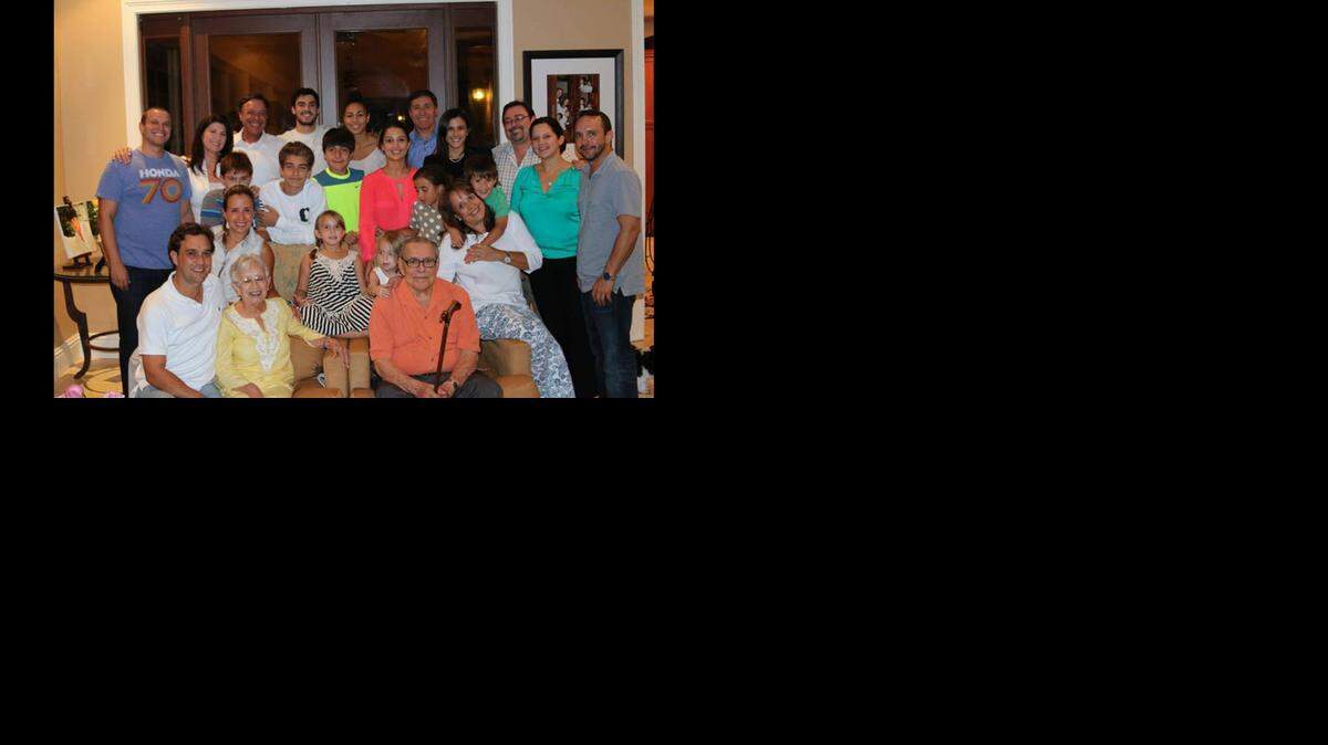 
Family picture. Mike Fernandez the 3rd on the left (white shirt). In the orange shirt is Fernandez’s dad, in yellow his mom.
