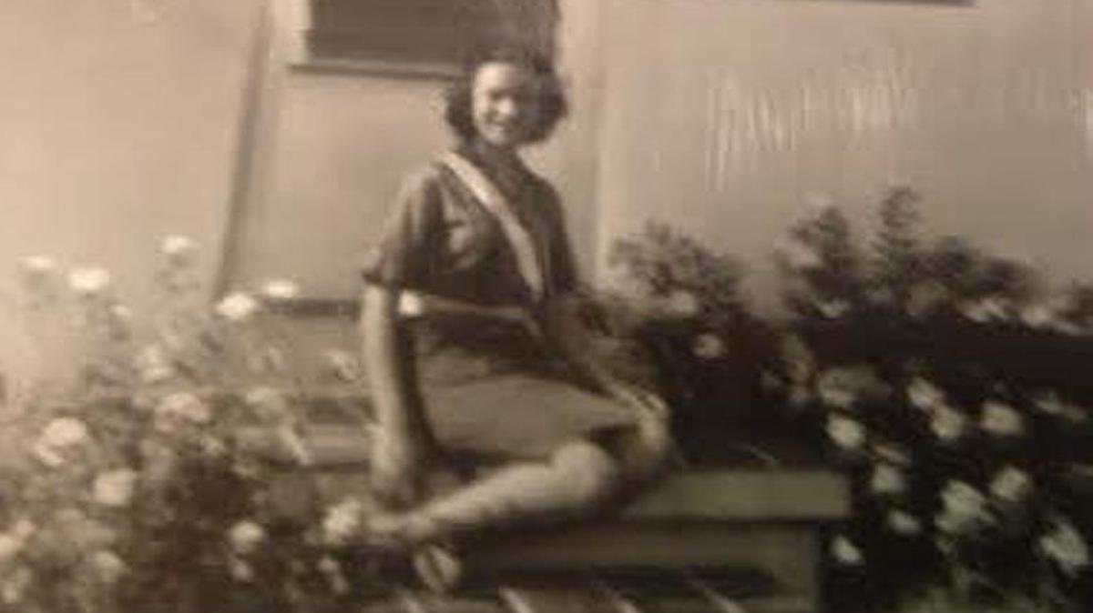 Lidia Epelbaum, then 12 in 1962, sitting outside her house on Española Way in Miami Beach, wearing her school patrol belt.