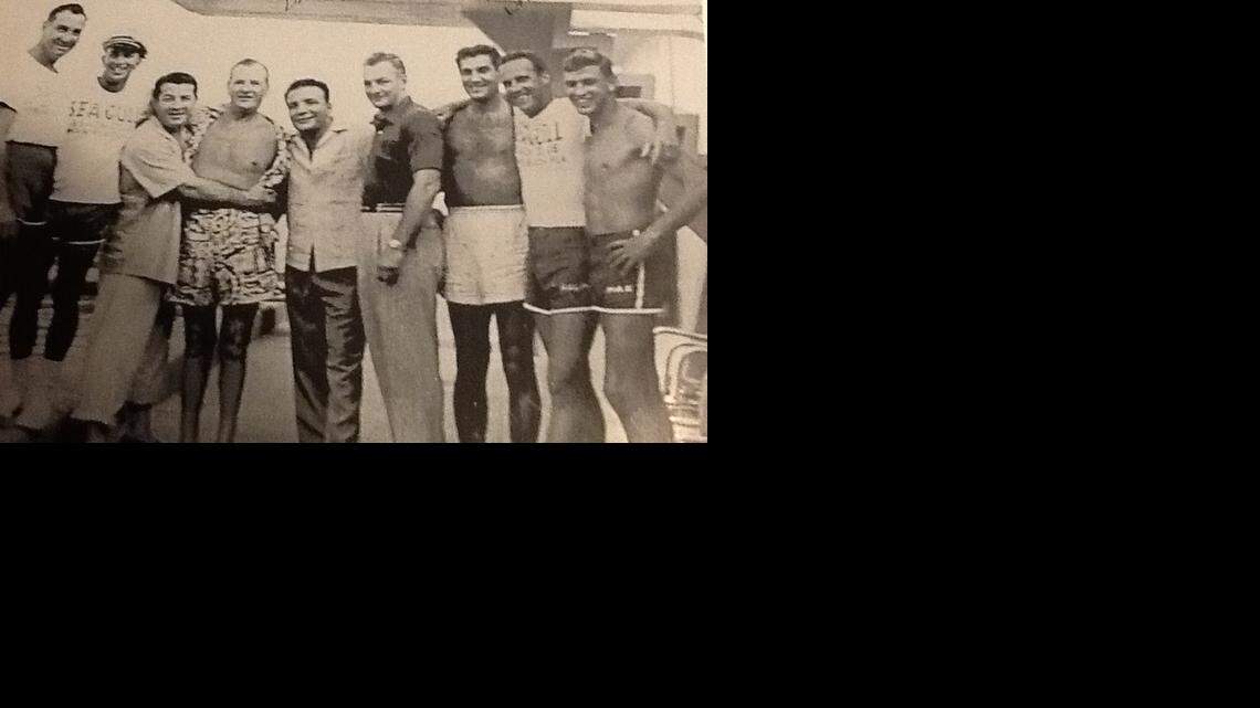 
The photo, taken at the Sea Gull hotel, shows the famous prizefighters, Jake LaMotta, (5th from left) and Rocky Graziano, (3rd from left). Dr. Max Dertke is first on the right with his name on the swimming trunks.

