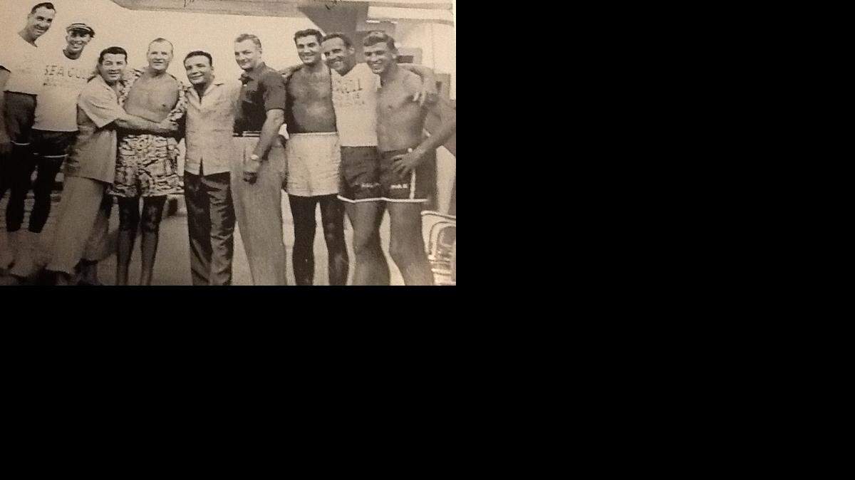 
The photo, taken at the Sea Gull hotel, shows the famous prizefighters, Jake LaMotta, (5th from left) and Rocky Graziano, (3rd from left). Dr. Max Dertke is first on the right with his name on the swimming trunks.
