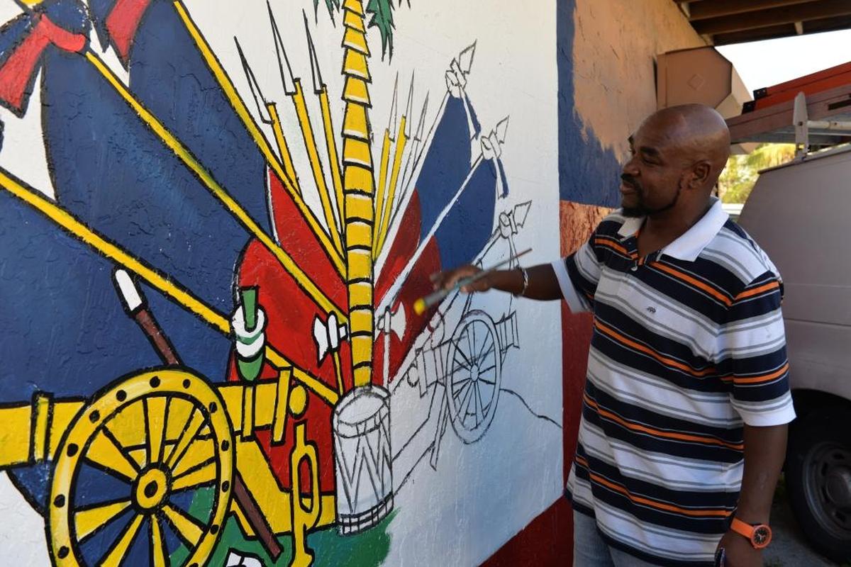 ‘I’m a realist artist. I’ve been painting my entire life. I do a lot of murals now, but I started painting with canvases in New York. It was too cold to do murals there’ says Haitian-American artist Serge Toussaint.