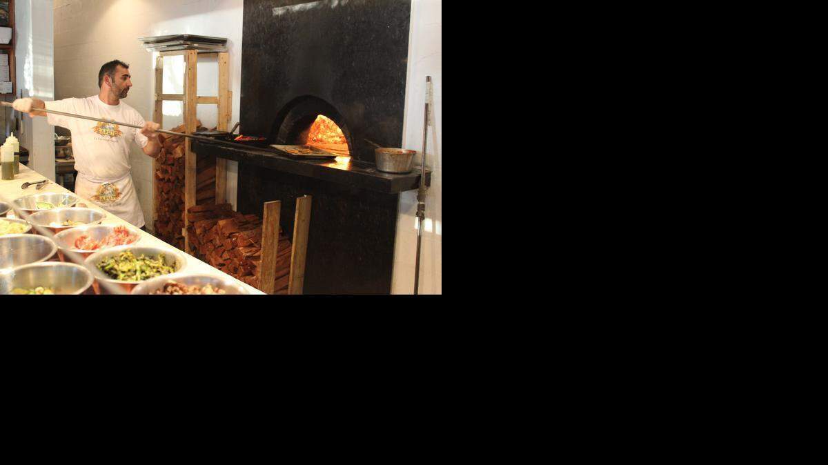 
Giovanni Gagliardi uses a coal-fired oven to cook his dishes, which are prepared with specific ingredients imported from Italy, such as the tomato, mozzarella and flour. 
