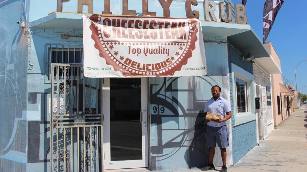 Postal worker Steven Martin delivers mail in Little Haiti and stopped by Philly Grub for its soft opening on Feb. 26.