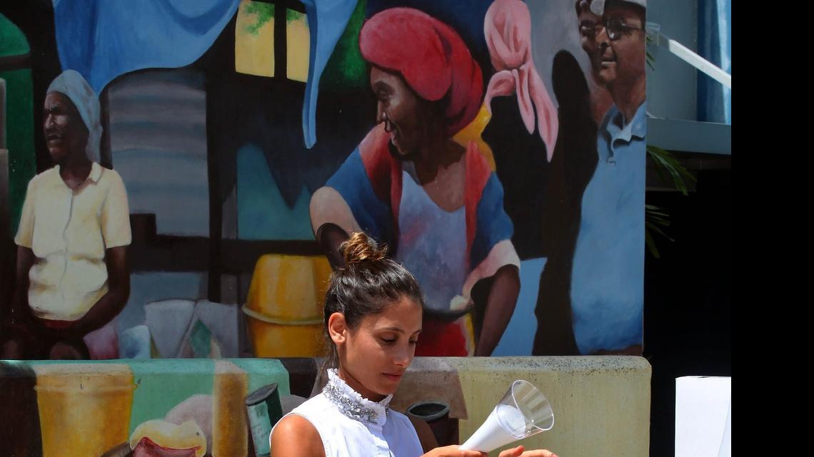 
Yara Akkari, a project coordinator for Arc Finance, sets up a T-Lite kit, which was on display at a event to launch the "Klere Ayiti" Thursday, July 23, 2015. This is a project that will help people, especially Haitian Americans, provide solar light kits to families in Haiti that have energy needs.
