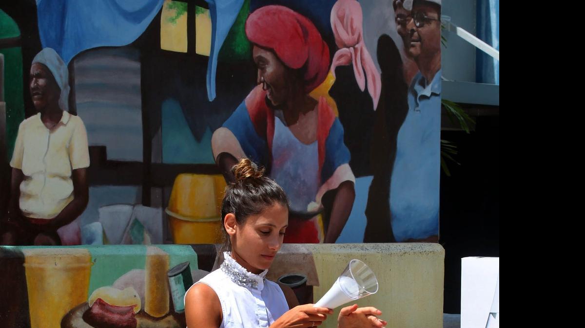 
Yara Akkari, a project coordinator for Arc Finance, sets up a T-Lite kit, which was on display at a event to launch the "Klere Ayiti" Thursday, July 23, 2015. This is a project that will help people, especially Haitian Americans, provide solar light kits to families in Haiti that have energy needs.
