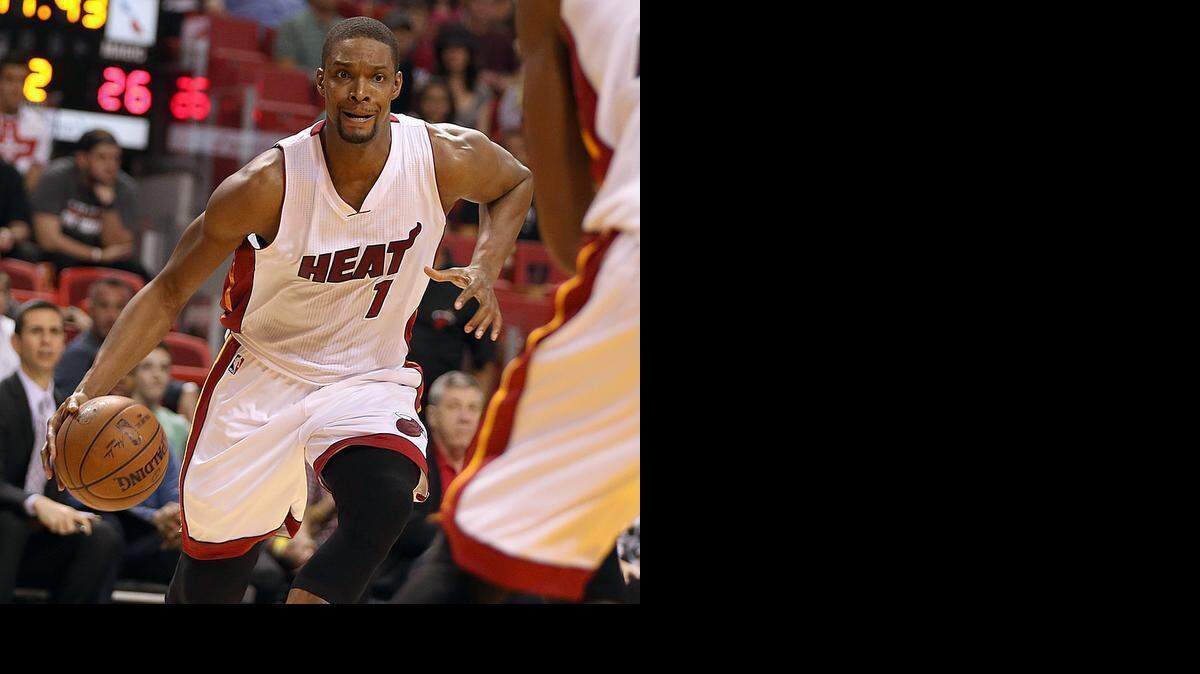 
Miami Heat’s Chris Bosh drives to the basket in the second quarter of the Miami Heat vs Orlando Magic game in December.
