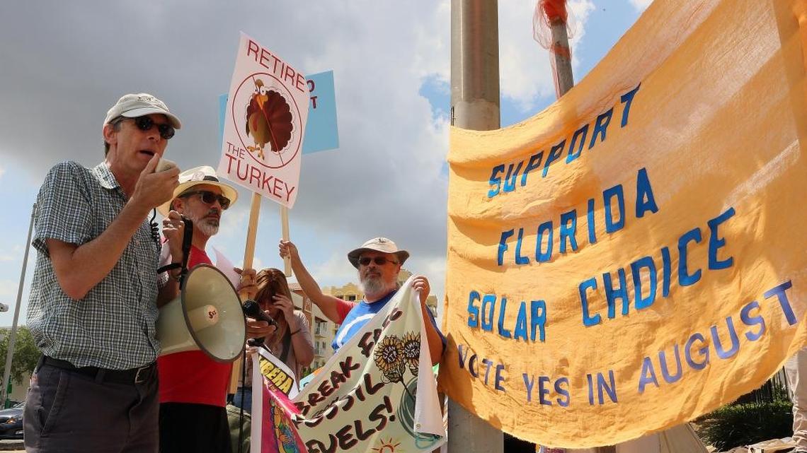 Philip K. Stoddard, of the City of South Miami, left, and Albert Gomez, second from left, attend a protest Saturday, May 14, 2016, outside of a Florida Power & Light facility in Miami concerning leaks at the nuclear power plant at Turkey Point.