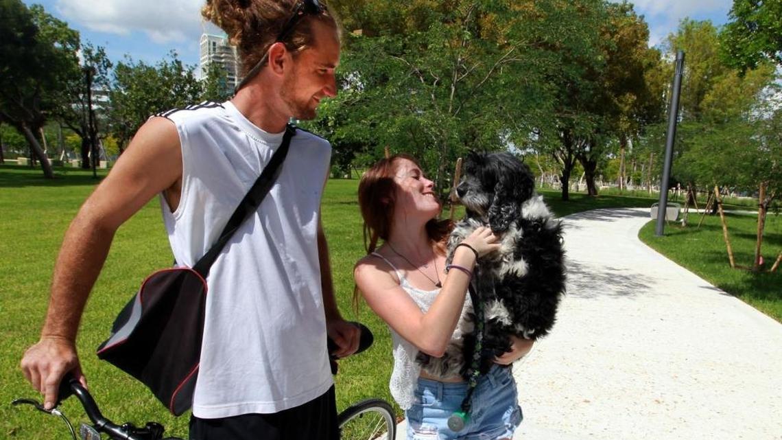 
Sean Moss and Shelby Jackman walk their dog Murphy in Regatta Park on Wednesday.

