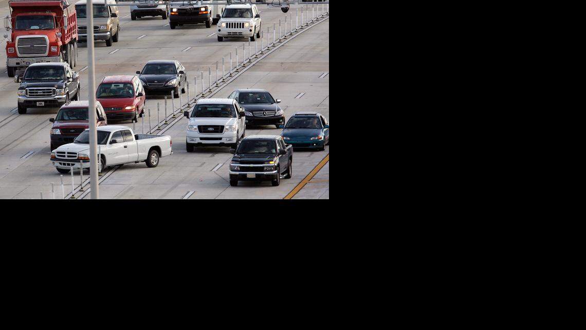 
LANE-DIVING: A pickup truck crosses the barricades separating the northbound I-95 express lanes, right, from normal traffic.
