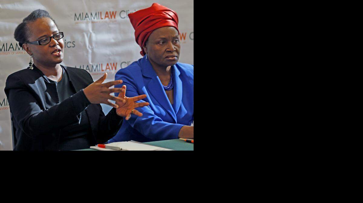 
Haitian-American author Edwidge Danticat spoke during news conference at the Little Haiti Cultural Center on Thursday, Feb. 19. At right is Marleine Bastien, Executive Director of Haitian Women of Miami, Inc. The Human Rights and Immigration Clinics at the University of Miami School of Law and the International Human Rights Clinic at University of Chicago released a report recommending that the US government stop deporting Haitians with criminal records until conditions improve.

