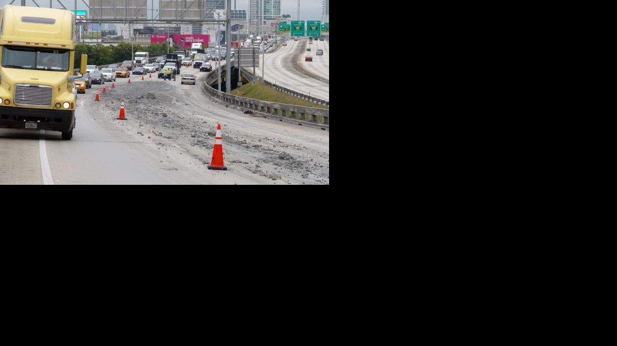 
Cement spread out on I-395 westbound at the I-95 exchange closing lanes down to one Friday Dec. 26, 2014.

