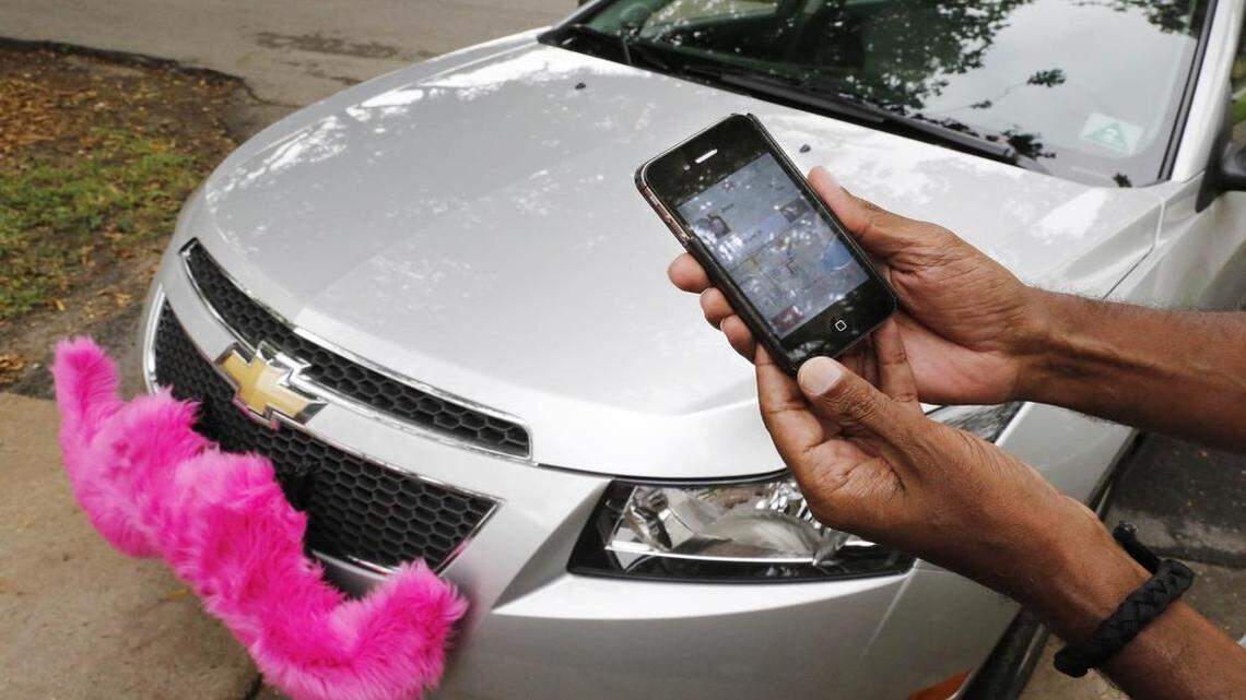 
A look at a Lyft car displaying the company’s trademark pink mustache in this 2014 file photo. 
