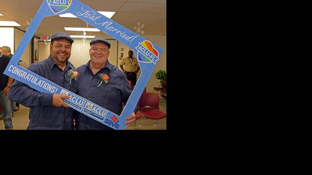 
Charles Windham and Edgard Perez, who got married Tuesday, posed at the Miami-Dade County clerk’s office.
