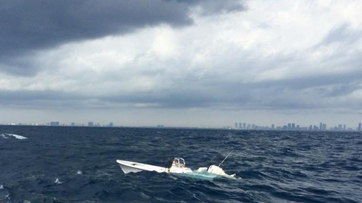 The U.S. Coast Guard, Miami-Dade Fire Rescue and Aventura Marine Patrol work to rescue two boaters aboard a vessel taking on water off of Haulover Inlet.