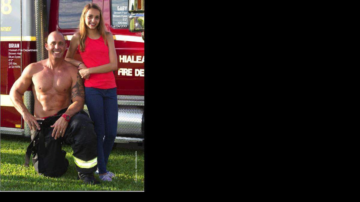 
Brian Allen, of the Hialeah Fire Department, and his daughter Gaby represent the month of December. 
