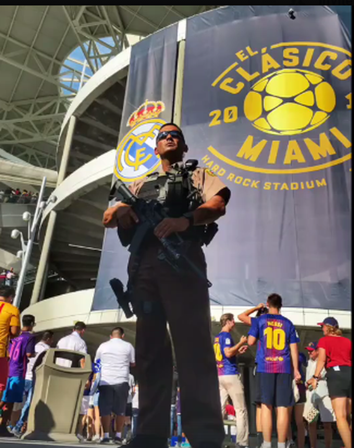 A Miami-Dade police officer with a rifle patrols outside the El Clasico soccer game at Hard Rock Stadium on July 30.