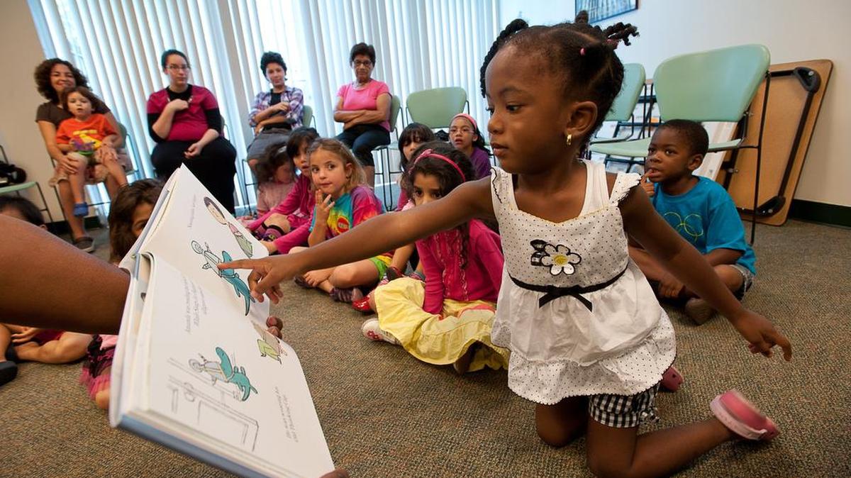 
Ayzia Brinson, 3, participated in a summer reading program at North Miami Beach public library in July 2012. The library is asking residents to fill out a survey to give suggestions and rate their various services.
