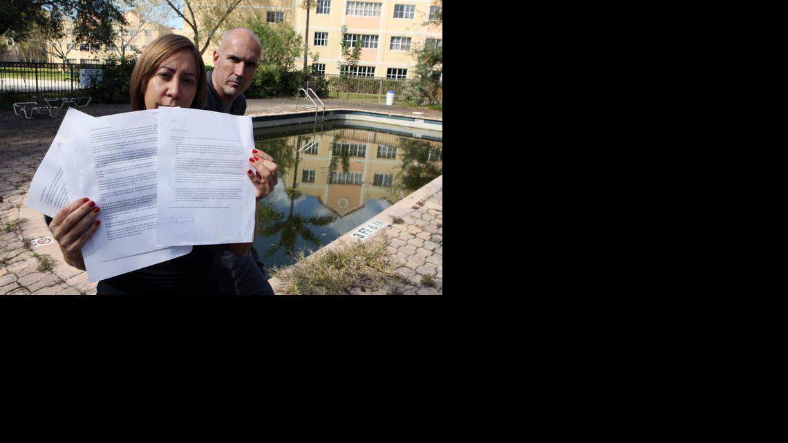 
Several elderly residents and disabled residents who live at the Mirassou condominium in Northwest Miami-Dade have had to rely on relatives and neighbors to help them up and down the stairs. The elevators in the building have been broken for years. In this photo, Aida Ortiz holds documents outlining complaints while Miguel Corral, another resident, looks on.


